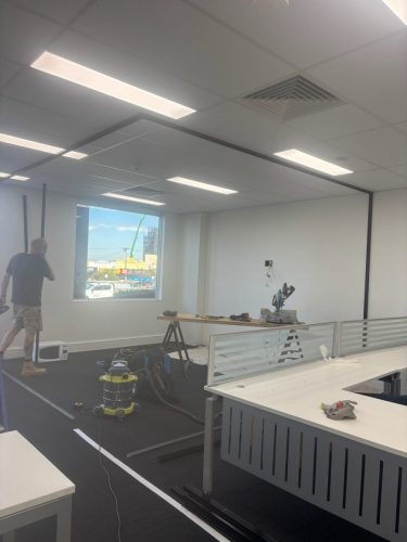 Intesols-Boardroom-WIP-Glass-Panel-Installation-scaled